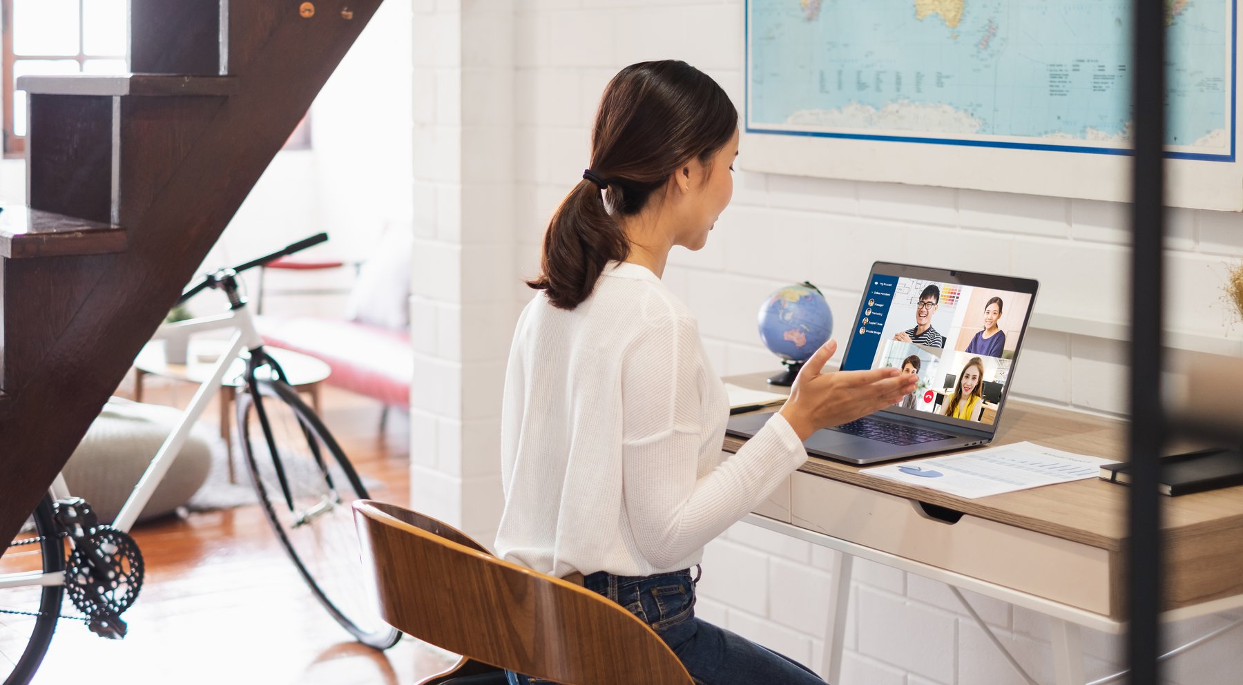 An employee works remotely in a home setting